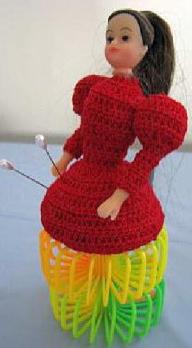 Doll with plastic spring skirt